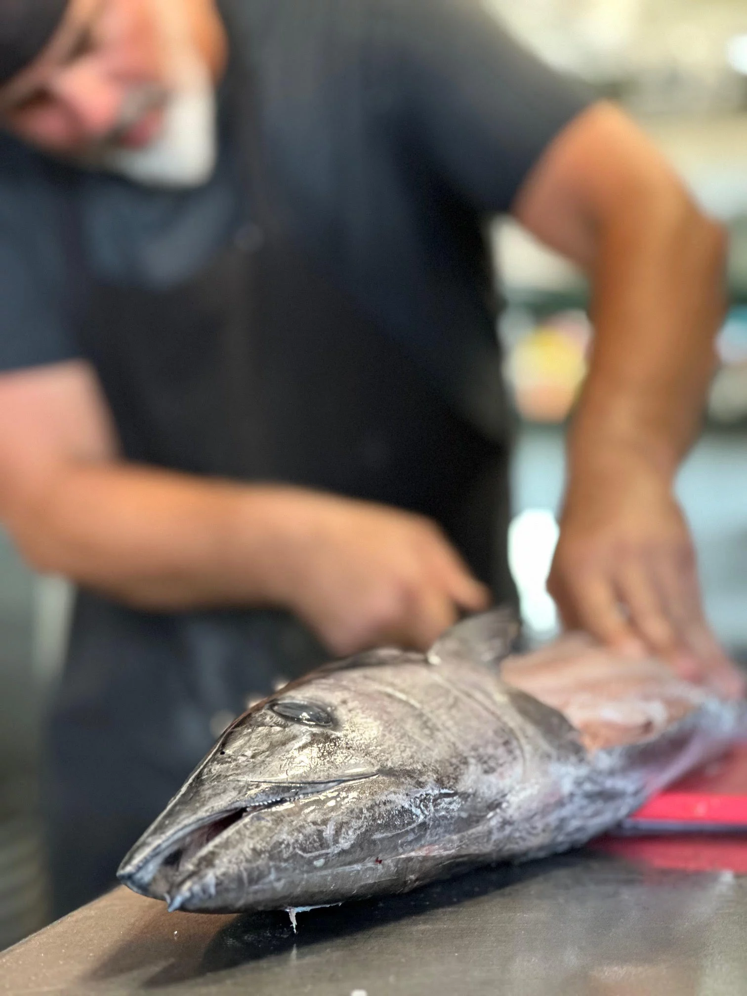 Man Cutting Fish